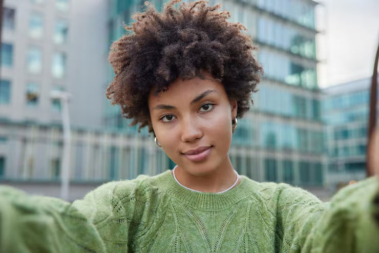 files/serious-beautiful-young-woman-stretches-arms-makes-selfie-walk-urban-setting-wears-casual-green-jumper-has-confident-look-camera-female-blogger-records-video-front-camera_273609-56681.avif